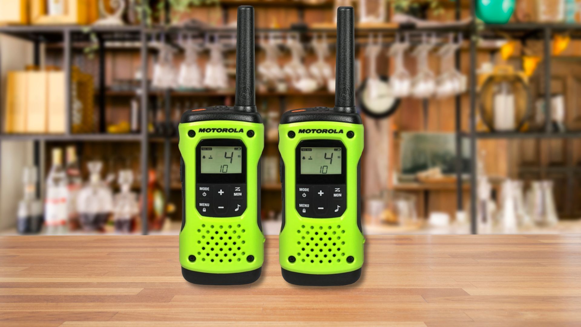 A pair of Motorola Talkabout Radios sitting on a wood counter