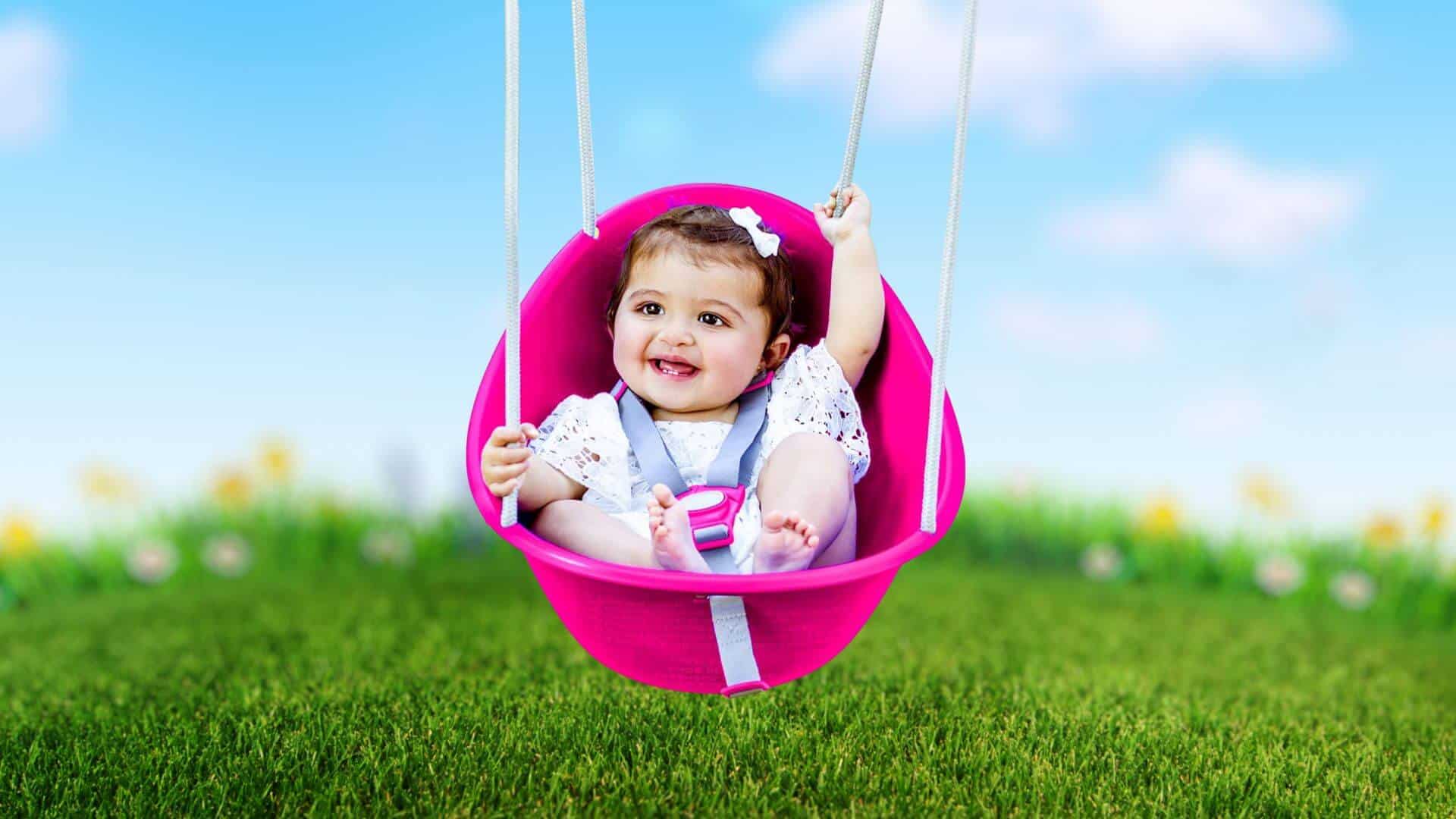 Swurfer Coconut Brand swing with baby swinging in it